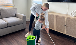 Mother and Child clean floors with Rinse 'n Wring Mop System