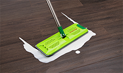 Rinse 'n Wring cleaning milk on wood floor